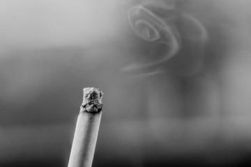 black and white photo of lit cigarette