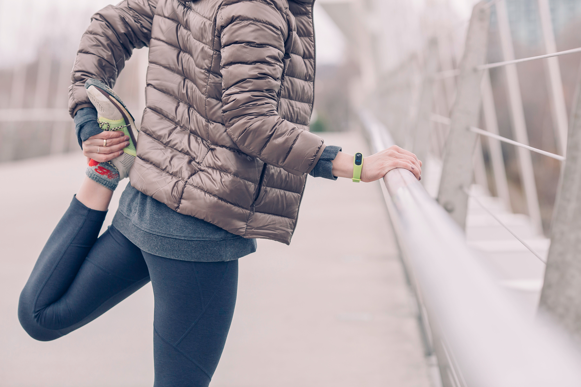 woman stretching leg behind back