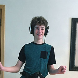 male teen wearing headphones